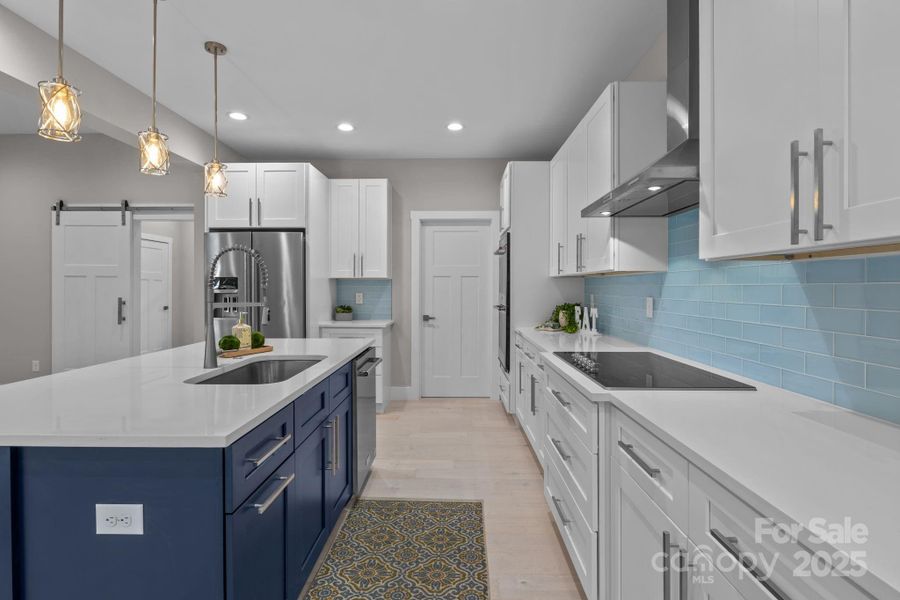 Quartz countertops and soft-close natural wood cabinetry.