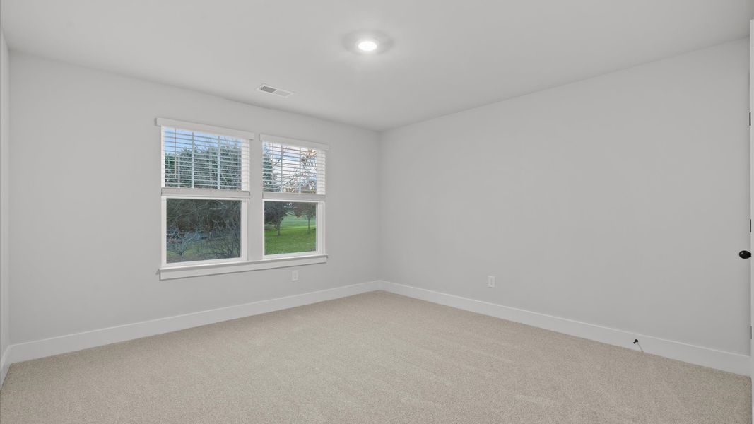 First-rate bedroom with plush carpeting and large windows that provide an open, airy feel First-rate bedroom with plush carpeting and large windows that provide an open, airy feel