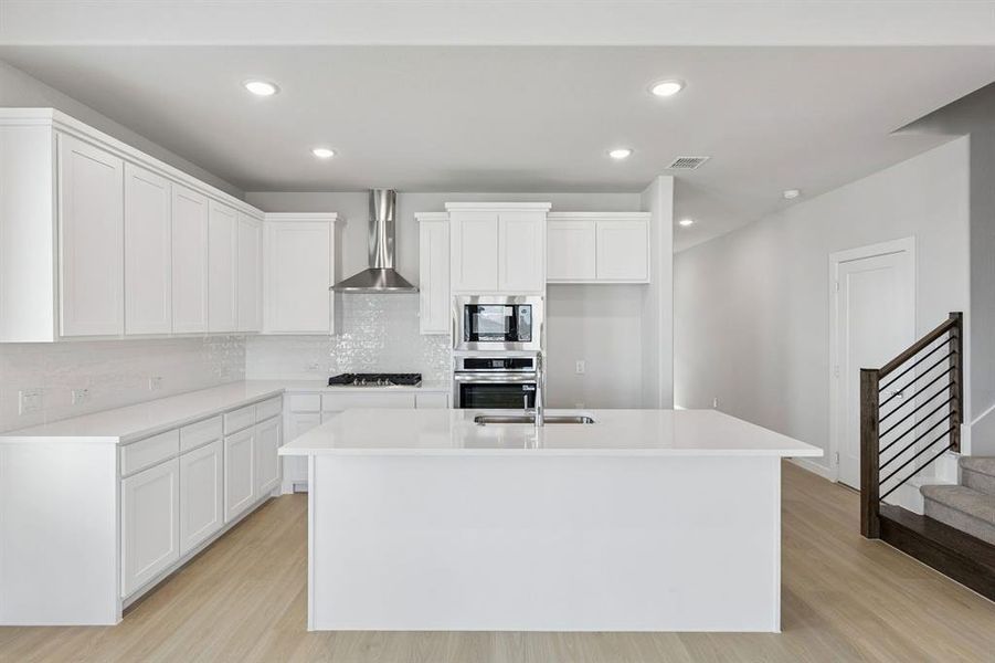 Kitchen in the Stanley II home plan by Trophy Signature Homes – REPRESENTATIVE PHOTO