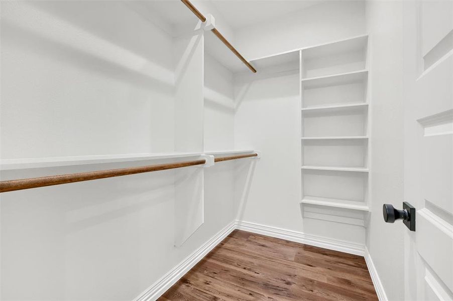 Walk in closet featuring hardwood / wood-style floors