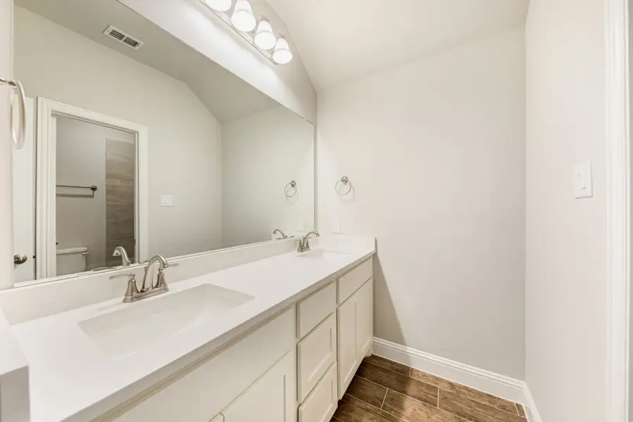 Representative furnished interior of a home built from the Nueces by UnionMain Homes in Lake Breeze, Lavon (Image 6).