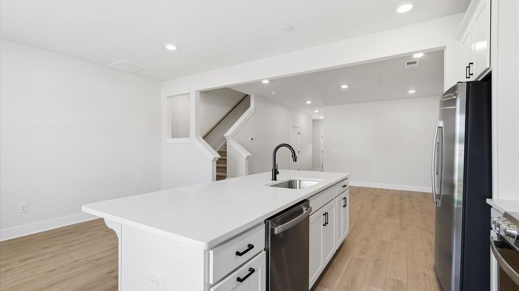 Memorable meals begin in this vibrant kitchen with quartz countertops and a thoughtfully designed island in Piedmont, SC Memorable meals begin in this vibrant kitchen with quartz countertops and a thoughtfully designed island in Piedmont, SC