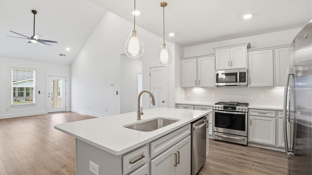 Elegant and compact island anchors this tasteful kitchen with high standards and timeless appeal at Village at Midway Elegant and compact island anchors this tasteful kitchen with high standards and timeless appeal at Village at Midway
