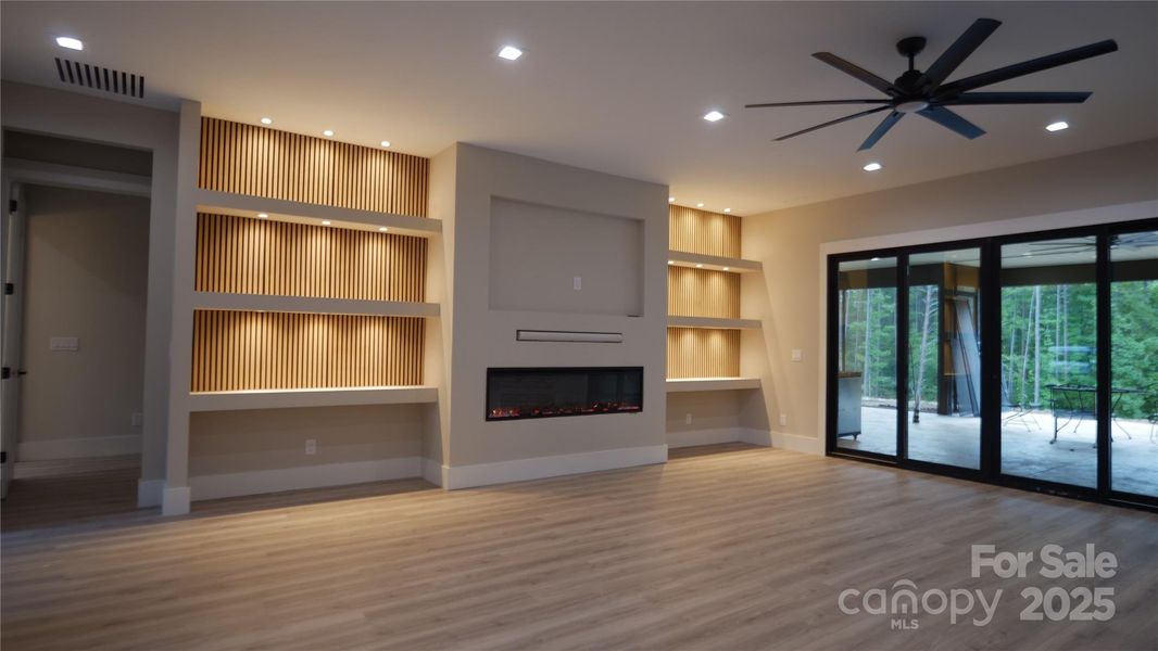 Living room with lighted built-ins (representational only) Living room with lighted built-ins (representational only)