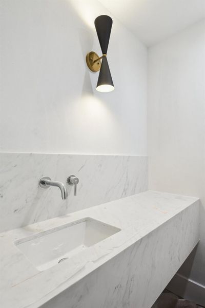 Located off the MUD room is a Second Powder Room to service the outdoor Pavillion.