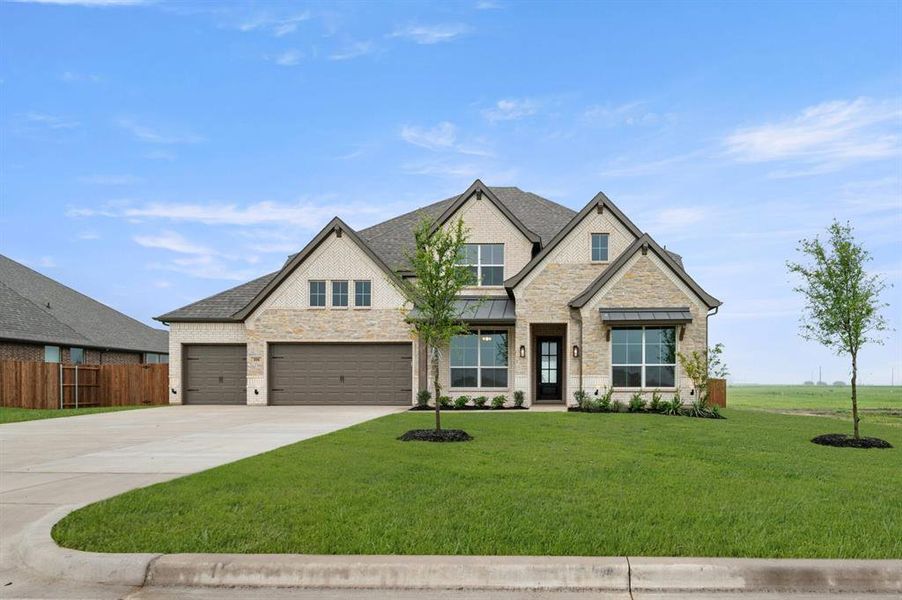 Front exterior of a new home in Coyote Crossing, Godley, TX, highlighting curb appeal (Image 2).