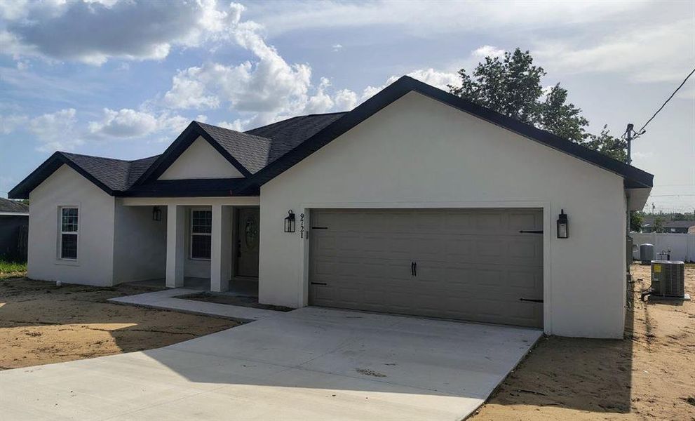 Front exterior of a new home in , Ocala, FL, highlighting curb appeal (Image 1).