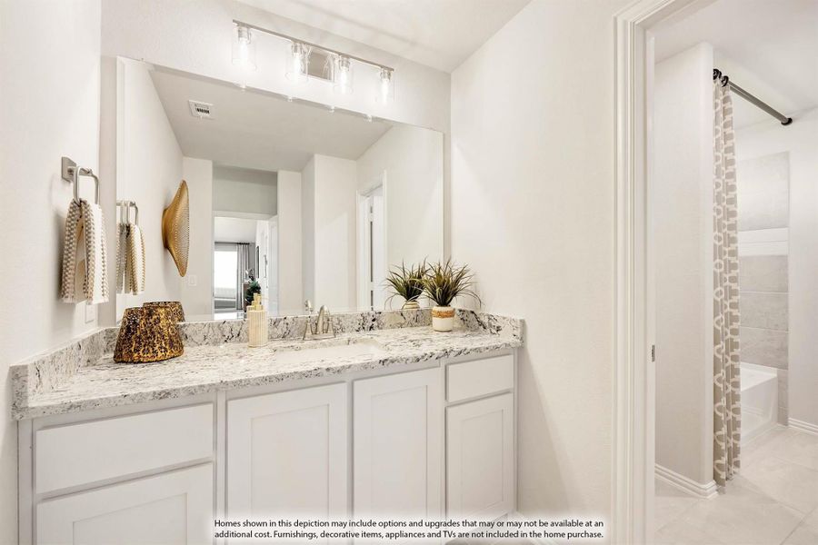 Bathroom vanity with white cabinets, granite countertop, large mirror, and view of tub with curtain nearby. Bathroom vanity with white cabinets, granite countertop, large mirror, and view of tub with curtain nearby.