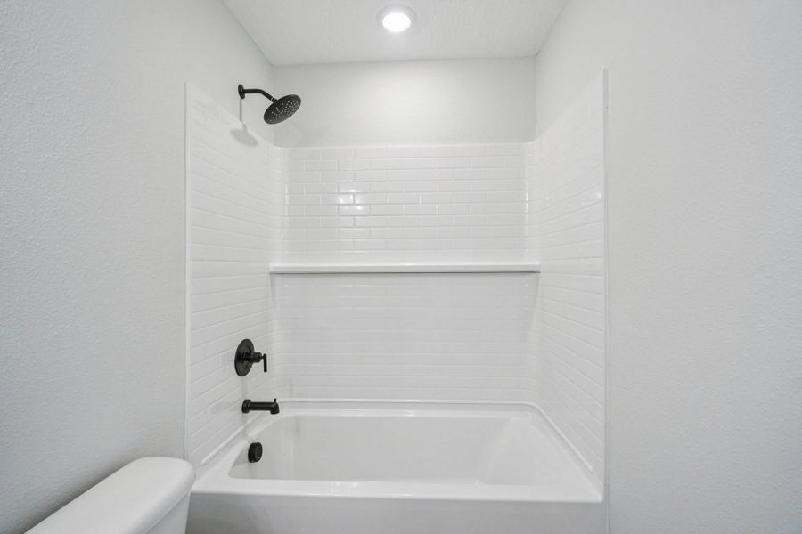 Bathroom 2 features an elegant shower and tub combo