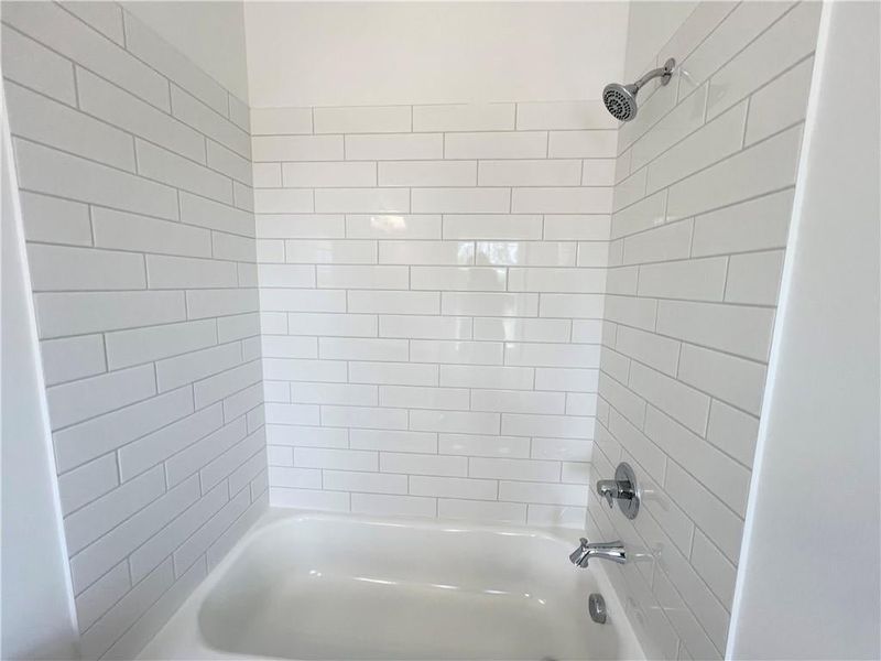 Full bath featuring bathing tub / shower combination