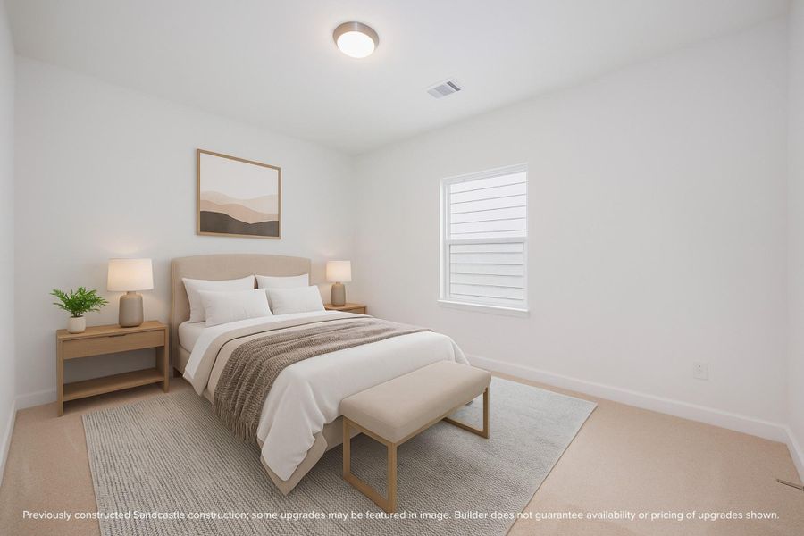 Perfectly sized, this secondary bedroom features a walk-in closet with custom shelving for maximum organization.