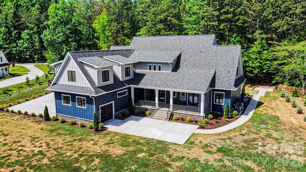 Front exterior of a new home in , Mint Hill, NC, highlighting curb appeal (Image 23).
