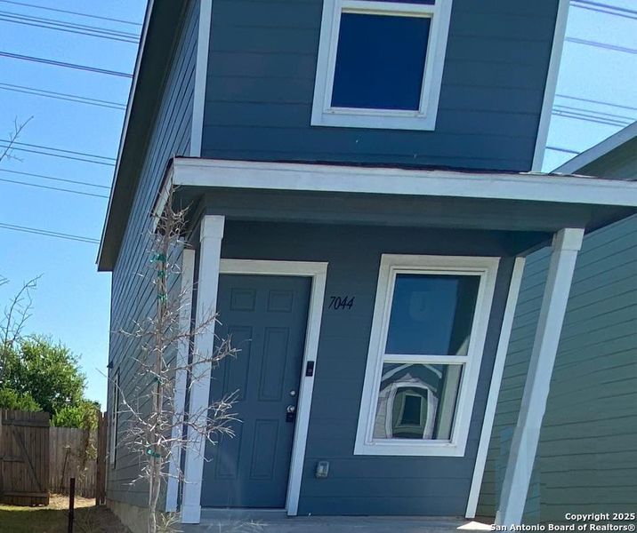 Front exterior of a new home in Elm Trails, San Antonio, TX, highlighting curb appeal (Image 2). Front exterior of a new home in Elm Trails, San Antonio, TX, highlighting curb appeal (Image 2).