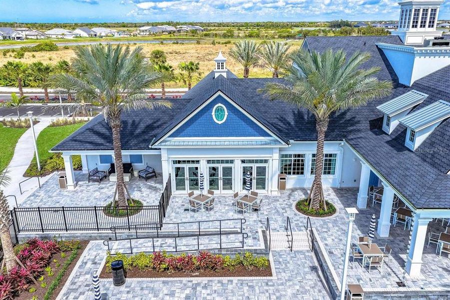 Front exterior of a new home in Palmera Wellen Park - Classic Series, Venice, FL, highlighting curb appeal (Image 2). Front exterior of a new home in Palmera Wellen Park - Classic Series, Venice, FL, highlighting curb appeal (Image 2).
