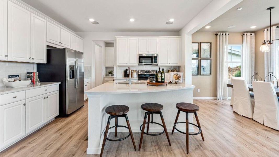 Furnished interior view inside a new home in The Aurora Highlands, Aurora (Image 5).