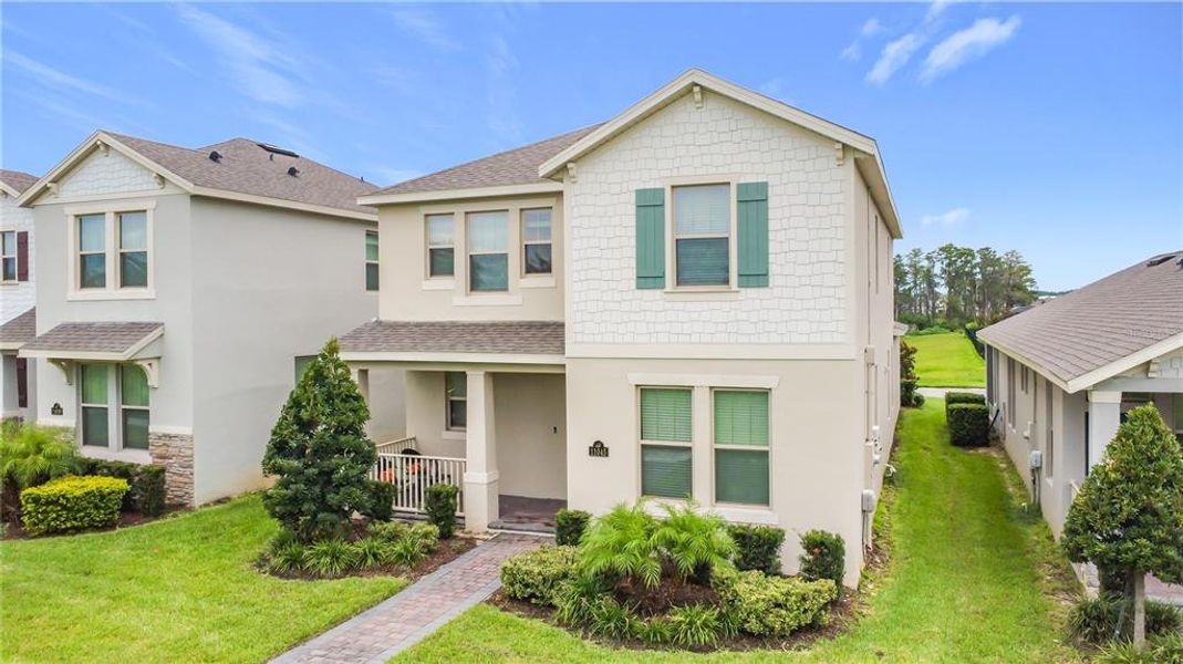 Front exterior of a new home in , Winter Garden, FL, highlighting curb appeal (Image 21).