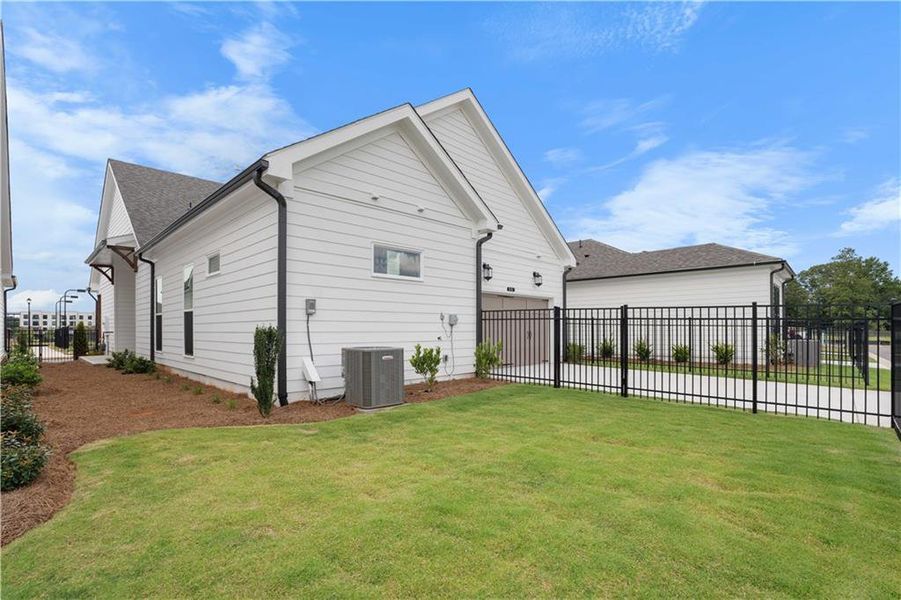 Exterior details and patio area of a home in Promenade at Sawnee Village, Cumming (Image 4). Exterior details and patio area of a home in Promenade at Sawnee Village, Cumming (Image 4).