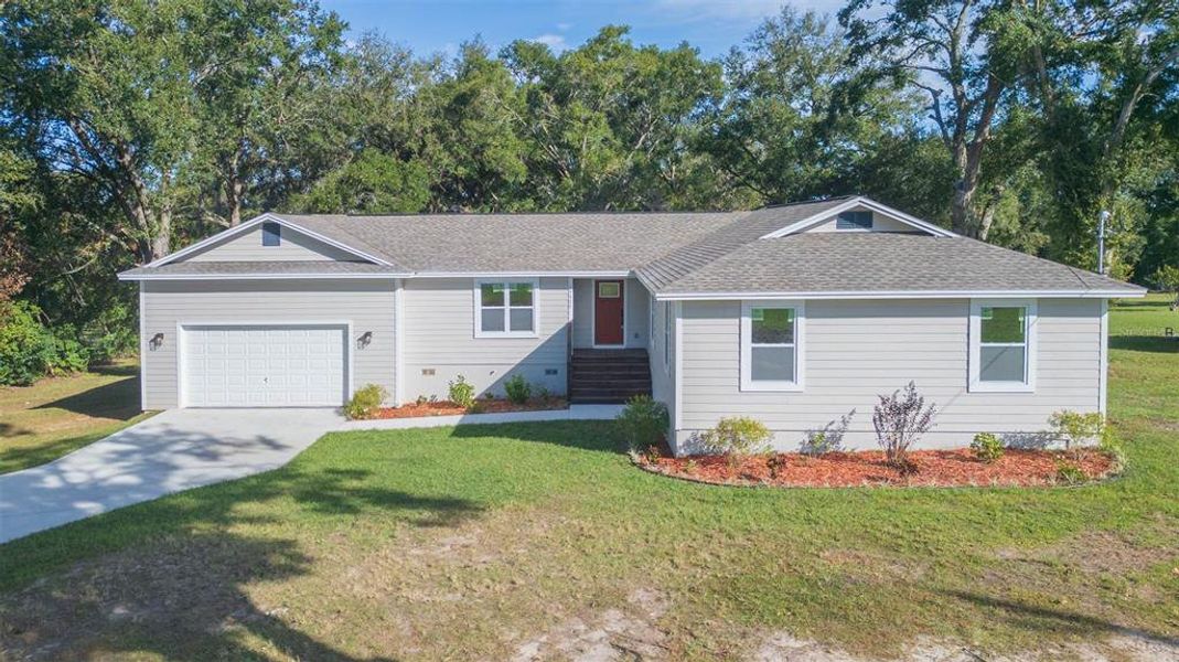 Front exterior of a new home in , Dade City, FL, highlighting curb appeal (Image 22).