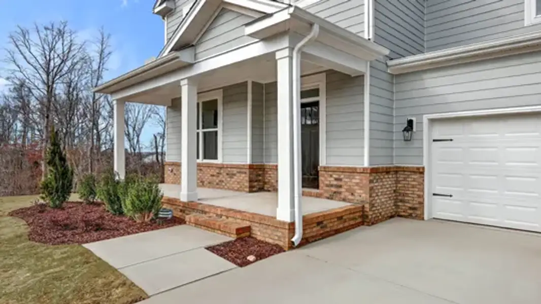 Exterior details and patio area of a home in The Estates Park, Apex (Image 3).