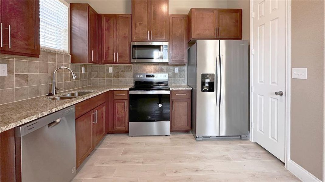 Soft close talk, custom cabinets, stainless appliances