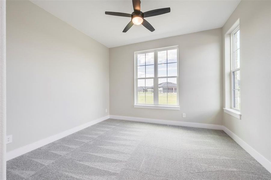 Unfurnished room with light carpet and ceiling fan