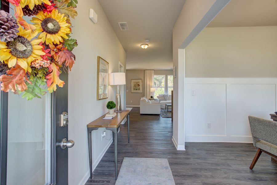 Welcoming foyer with dining room:study area to the side