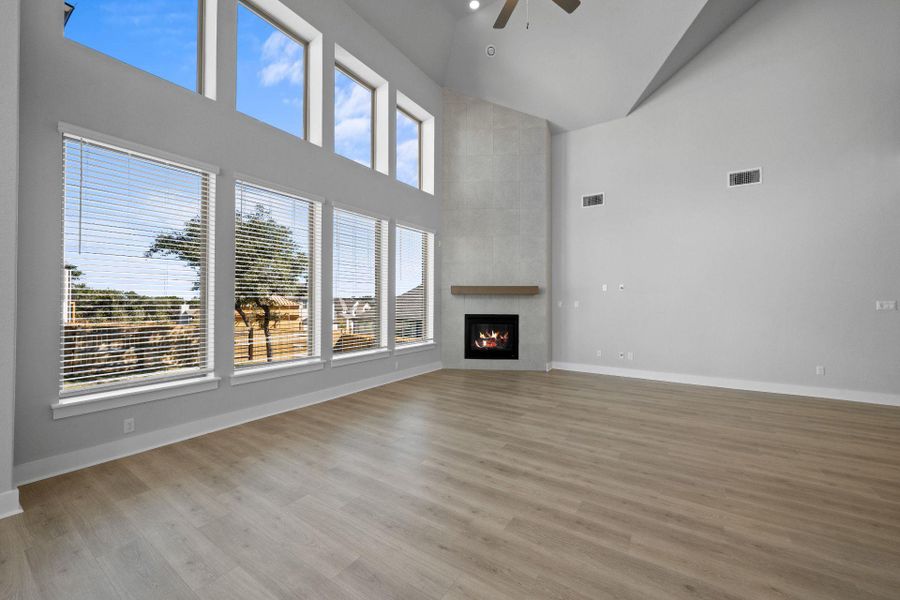 Family Room with soaring ceiling & fireplace