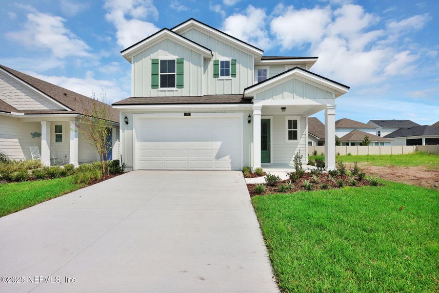 Front exterior of a new home in Seabrook Village at Nocatee, Ponte Vedra, FL, highlighting curb appeal (Image 26).