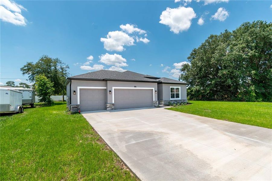 Front exterior of a new home in , Ocala, FL, highlighting curb appeal (Image 20).