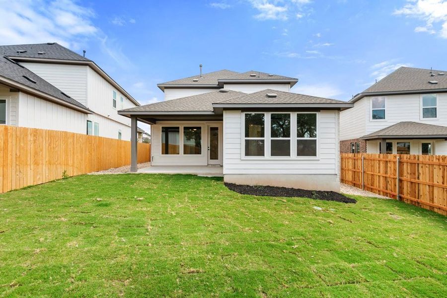 Exterior details and patio area of a home in Heritage, Dripping Springs (Image 24).