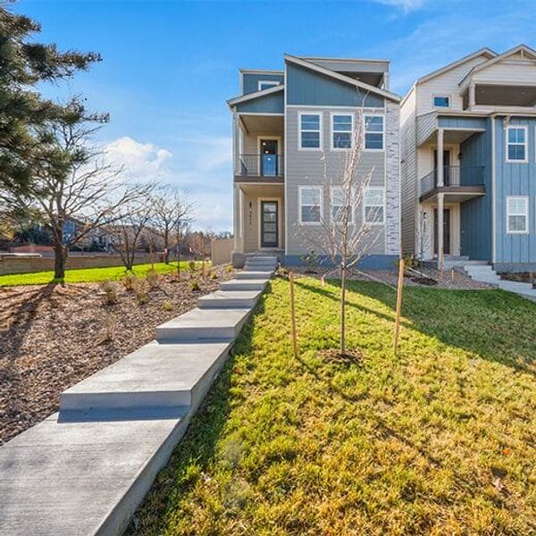 Front exterior of a new home in Pony Park, Colorado Springs, CO, highlighting curb appeal (Image 1).