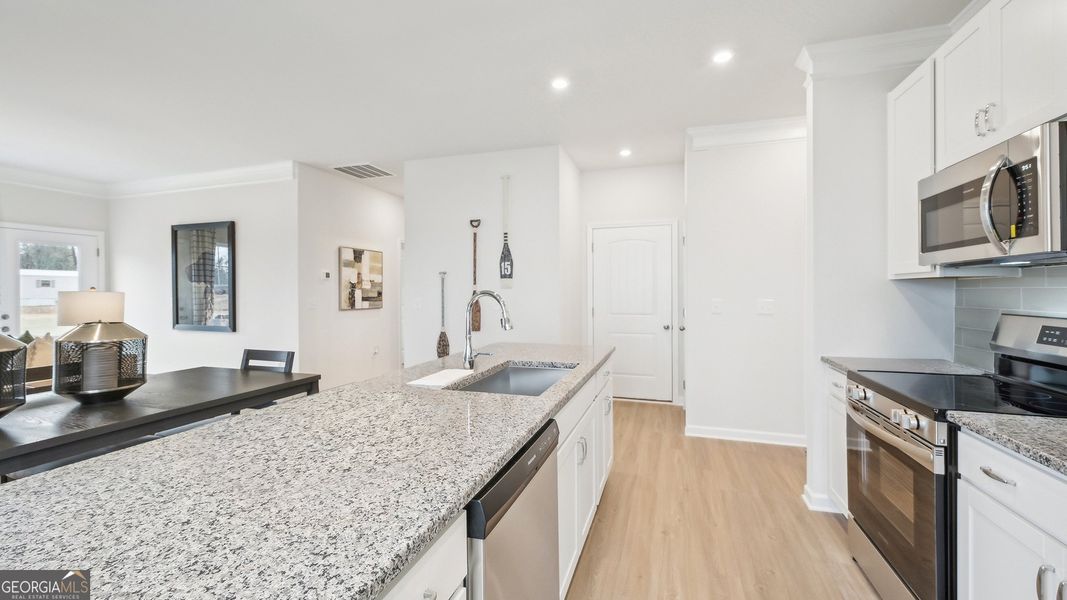 Furnished interior view inside a new home in Maddox Station, Eatonton (Image 4).