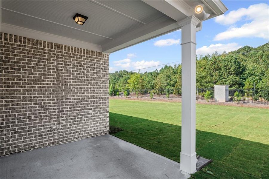 Exterior details and patio area of a home in Overland, Locust Grove (Image 2).