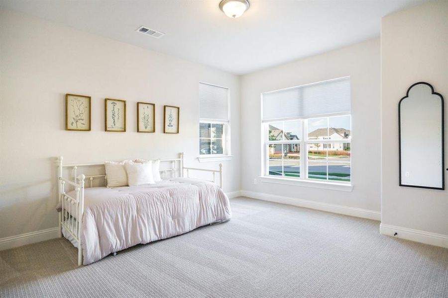 Sunlit Corner Retreat - This spacious secondary bedroom captures natural light from two angles and offers flexibility for a guest suite, reading room, or home studio. Sunlit Corner Retreat - This spacious secondary bedroom captures natural light from two angles and offers flexibility for a guest suite, reading room, or home studio.