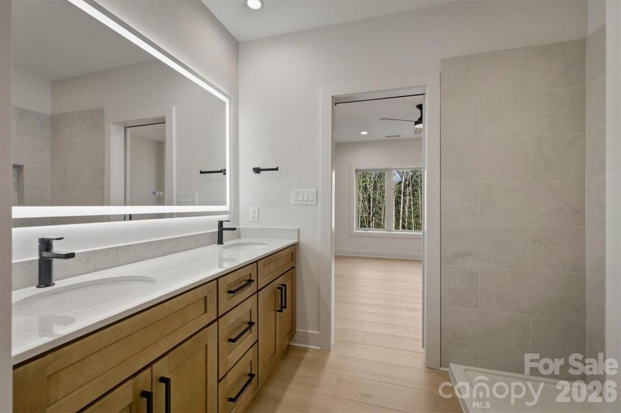 The dual sinks have the same lovely black contemporary bathroom fixtures just like the rest of the house and the same gorgeous high quality, soft close wood cabinets that are throughout. The dual sinks have the same lovely black contemporary bathroom fixtures just like the rest of the house and the same gorgeous high quality, soft close wood cabinets that are throughout.