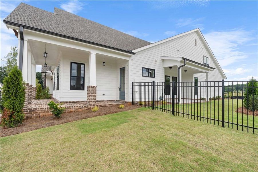 Front exterior of a new home in Promenade at Sawnee Village, Cumming, GA, highlighting curb appeal (Image 25).