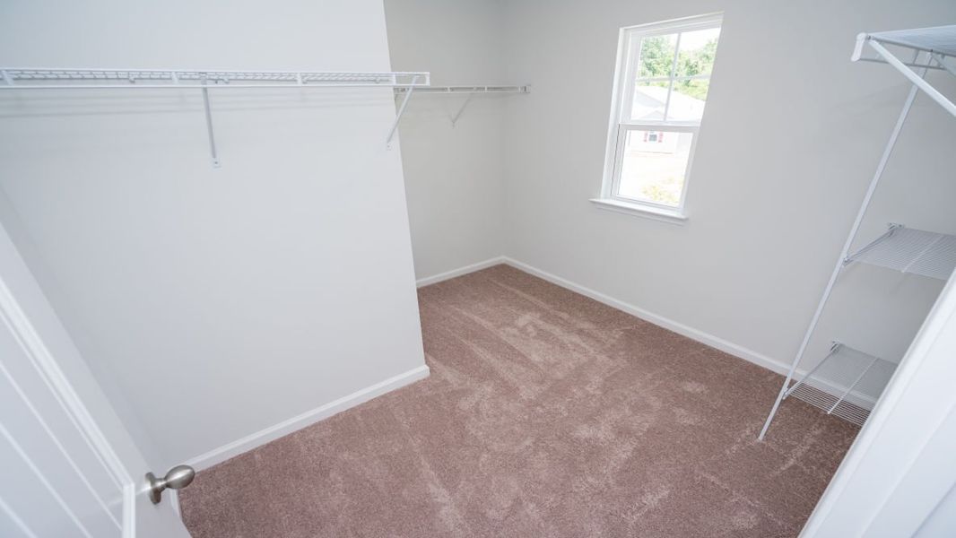 Representative unfurnished interior of a home built from the ROBIE by D.R. Horton in Indigo Preserve, Leland (Image 35).