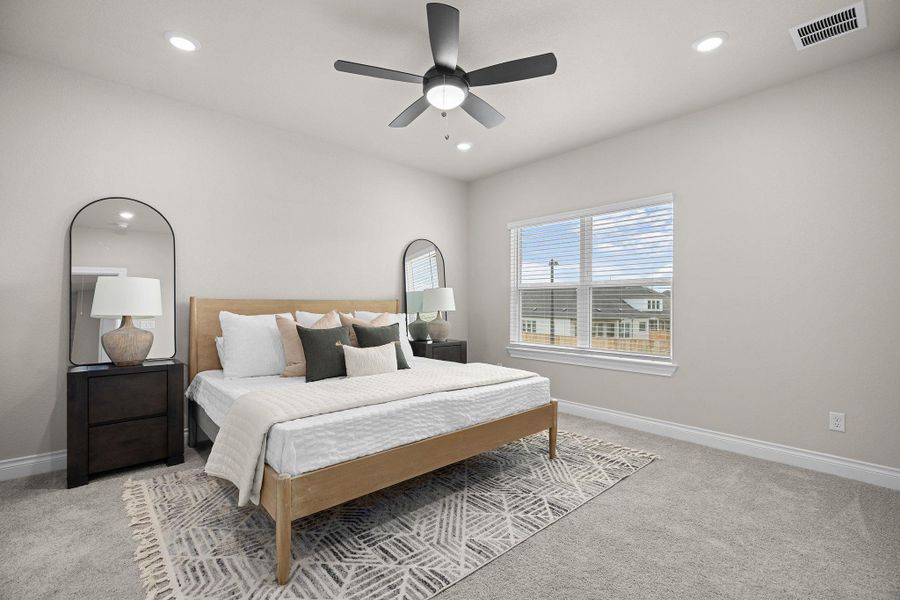 Bedroom featuring light carpet, recessed lighting, and a ceiling fan