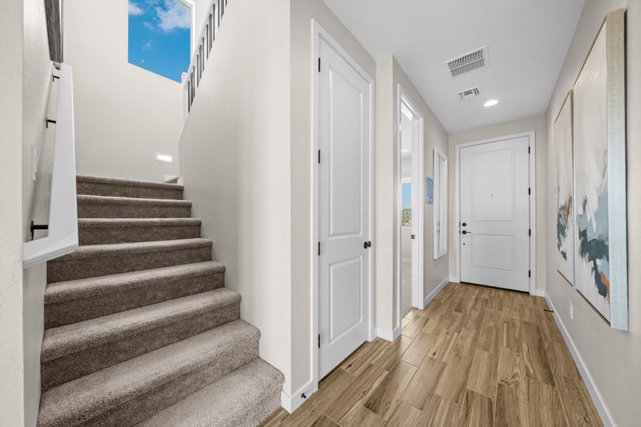 Staircase & Entry into Bedroom 5 | Skyline Floorplan | Elara at Moonlight | New Homes in Maricopa, AZ by Landsea Homes