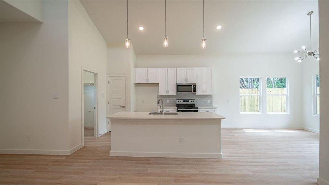 Kitchen and dining area with decorative lighting