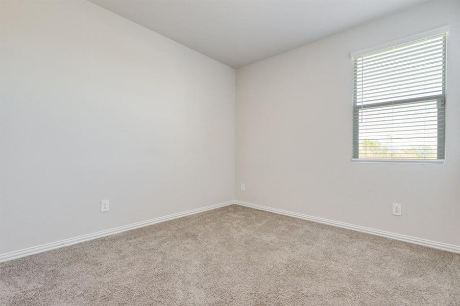 Spare room with carpet floors and baseboards