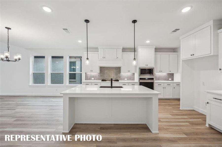 Featuring outstanding space, storage and style, this dream kitchen has it all!  REPRESENTATIVE PHOTO