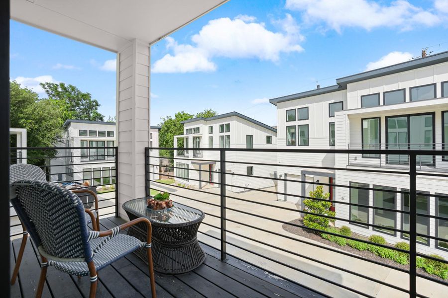 Unwind on this balcony overlooking a modern community of striking, contemporary residences. Unwind on this balcony overlooking a modern community of striking, contemporary residences.