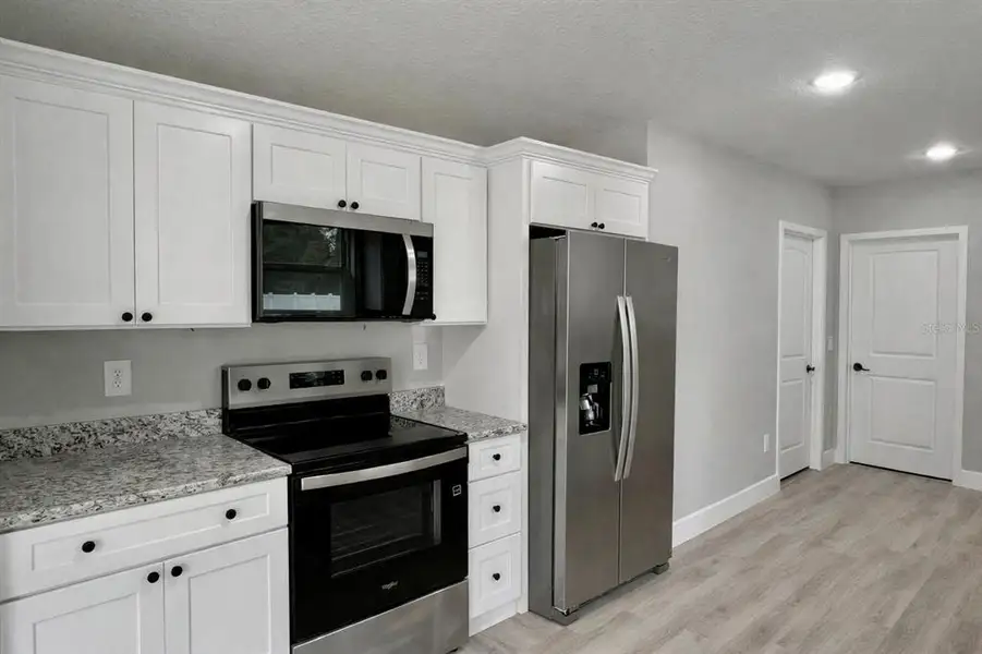 Furnished interior view inside a new home in , Belleview (Image 3).