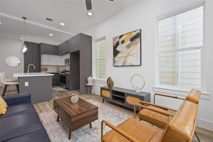 Within minutes of all Heights has to offer, this 3 bedroom, 3 full bath, and one half bath home is in a gated community.has a beautiful modern elevation and large windows that bring in ample natural light throughout the home.