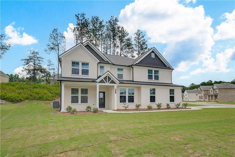 Front exterior of a new home in Trinity Park, McDonough, GA, highlighting curb appeal (Image 2).