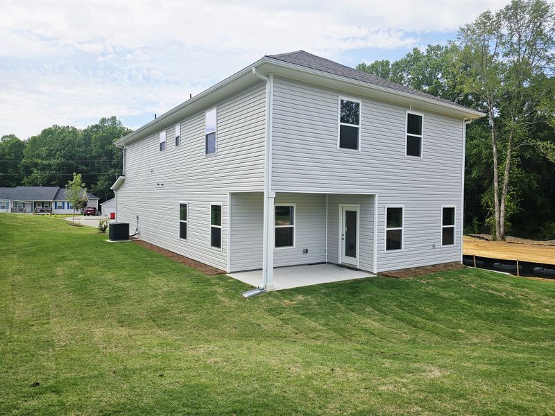 Front exterior of a new home in Scarlett Place, Bowdon, GA, highlighting curb appeal (Image 2).