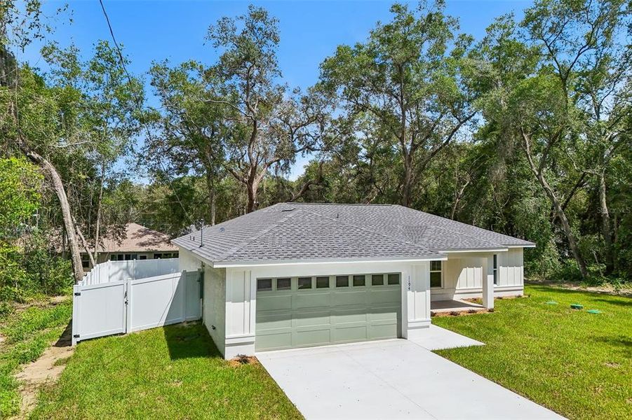 Front exterior of a new home in , Citrus Springs, FL, highlighting curb appeal (Image 25).