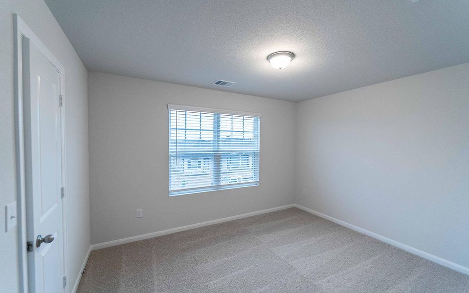 Spacious, unfurnished interior of a new home in Brooklands, Hutto (Image 13).