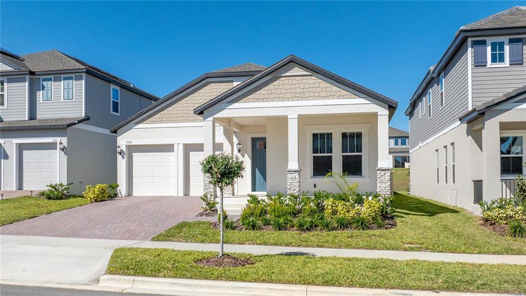 Front exterior of a new home in Silverleaf Reserve, Winter Garden, FL, highlighting curb appeal (Image 20).